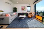 Cozy living room with pops of color and queen sized sleeper sofa for additional sleeping space